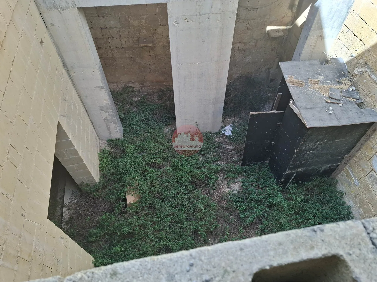 View looking down into the central courtyard of the structurally converted house
